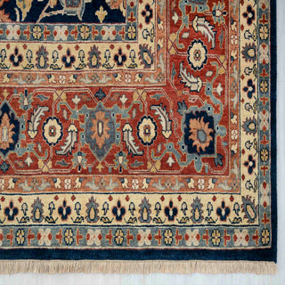Traditional hand-knotted wool rug, navy background with rust and gold flowers, decorative border 10x14
