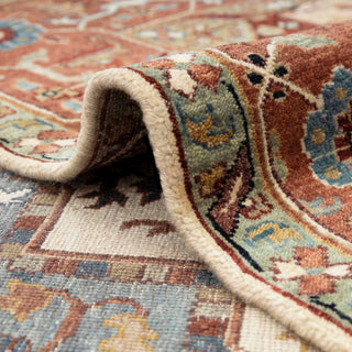 6x9 Classic medallion area rug featuring Heriz design, muted blue details, and decorative tribal border