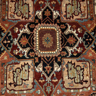 6x9 Traditional Persian Heriz rug with bold geometric medallion, rust tones, blue accents, and ornate border