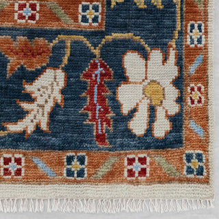 Modern hand-knotted rug with abstract ivory Oushak flowers, teal and rust accents, ideal for colorful boho interiors