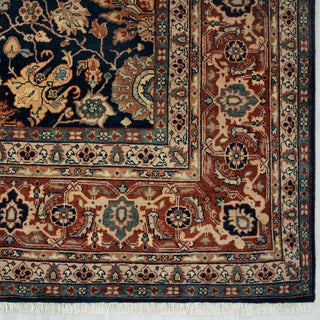 Oriental hand-knotted wool rug in navy with burnt orange and beige border, 8x10 size ideal for high-traffic spaces