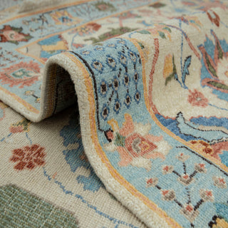 8x10 ft Heriz-style hand-knotted rug with scattered palmette motif in ivory blue red sage.