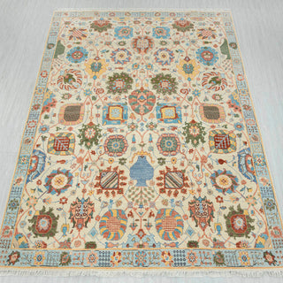 8x10 ft Indo-Persian hand-knotted rug in ivory teal coral with garden design.