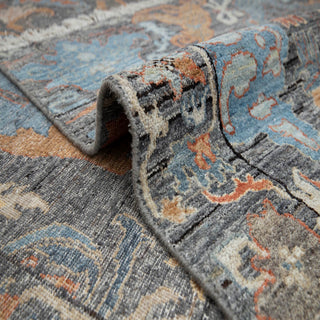 8x10 ft Indo-Persian hand-knotted rug with central floral motif in gray teal rust.