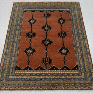 8x10 rust wool hand-knotted Persian rug with geometric medallion pattern and tribal border