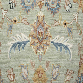 9x12 Hand-knotted wool rug featuring sparse floral pattern in seafoam gold rust, low-pile durable.