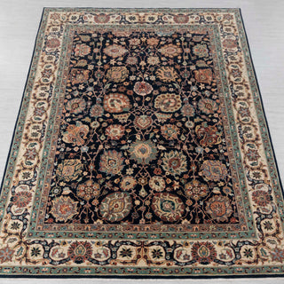 Hand-knotted wool rug in navy, ivory, and green with dense Persian floral design, 9x12