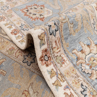 9x12 Oushak-style hand-knotted rug with palmette floral motif in ivory blue rust.