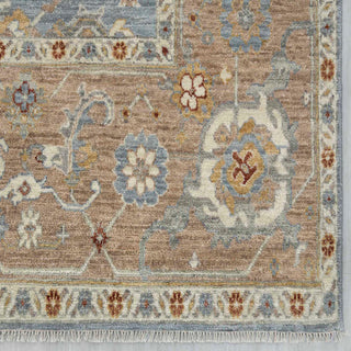 9x12 ft Modern hand-knotted rug with open floral pattern in denim blue tones.