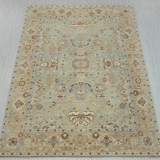 9x12 ft Sage hand-knotted rug in green ivory rust with open floral design.