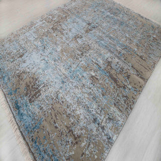 Abstract hand-knotted rug in blue grey with distressed faded design. 8x10 ft area rug, modern abstract pattern, durable wool pile.