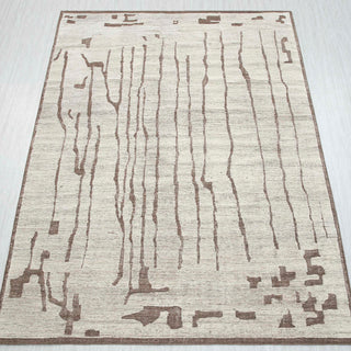 Abstract hand-knotted rug in ivory-beige & taupe with distressed streak design. 8x10 ft low-pile wool.
