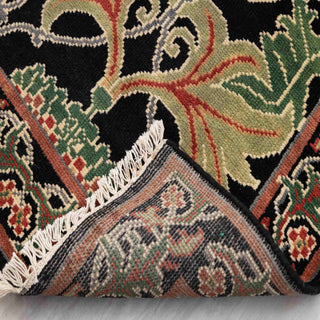 Arts and Crafts British-style hand-knotted rug with repeating potted flower motifs in black, green, rust