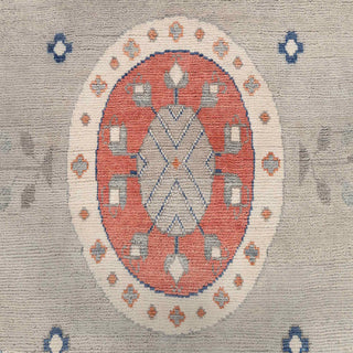 Caucasian-style hand-knotted rug with geometric medallion motif in grey, sky blue, rust, ivory tones.