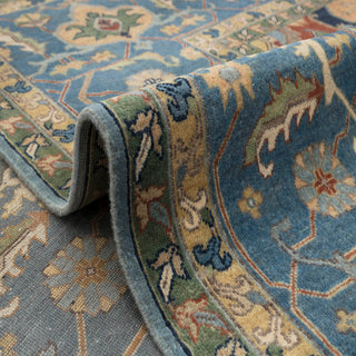 Durable 9x12 oriental area rug, blue field, rust medallion, navy border, wool pile for homes.