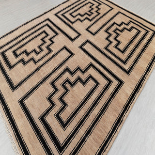 Flatweave camel wool area rug, strong black geometric frames, durable 8x10 carpet for dining or lounge.