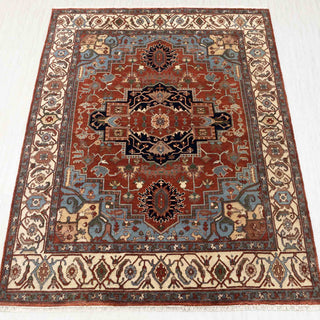 Hand-knotted rug in rust, navy, and ivory with large geometric Heriz medallion design, 9x12