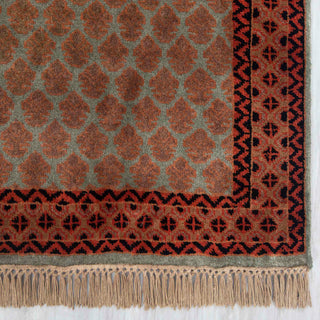 Gabbeh-inspired tribal hand-knotted rug with repeating geometric motifs in rust, teal, and dark brown tones