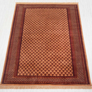 Gabbeh-style hand-knotted rug in beige, rust, brown with small boteh lattice pattern design, 6x9 ft