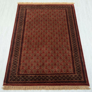 Gabbeh-style hand-knotted rug in rust, brown, burgundy with small boteh lattice pattern design, 3x5 ft