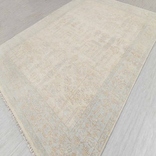 Hand-knotted rug in beige and soft lake blue with subtle tree-of-life garden design, 8x10 ft