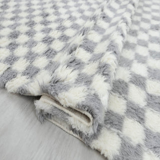 Hand-knotted rug in grey and ivory with small checkerboard pattern design, plush pile