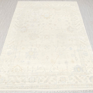 Hand-knotted rug in ivory and pale beige with subtle floral Oushak design, 8x10 ft