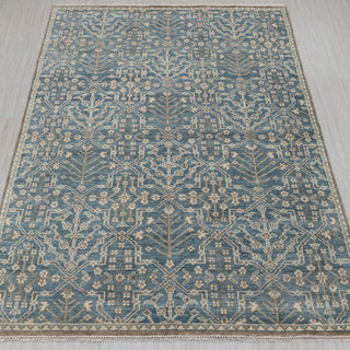 Hand-knotted rug in soft blue and ivory with geometric lattice and tree motif pattern design.