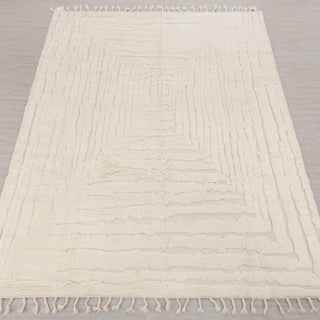 Hand-knotted rug in solid ivory with concentric stepped geometric pattern design, 9x12