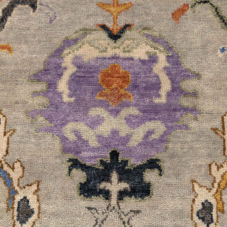 Hand-knotted wool rug featuring Oushak medallion and floral pattern in tan, blue, rust, 8x10.
