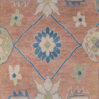 Hand-knotted wool rug featuring Oushak tribal floral pattern in peach, blue, green, 8x10.
