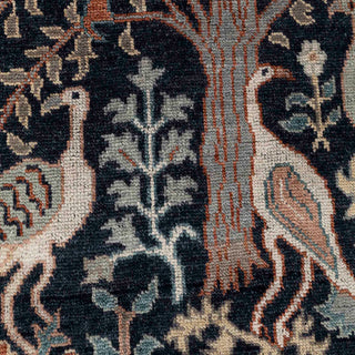 Hand-knotted wool rug featuring Tree of Life pattern with peacocks and blossoms in navy, rust, 8x10.