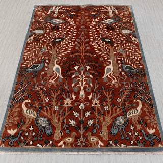 Hand-knotted wool rug featuring Tree of Life pattern with peacocks and flowers in rust, teal, cream, 8x10.