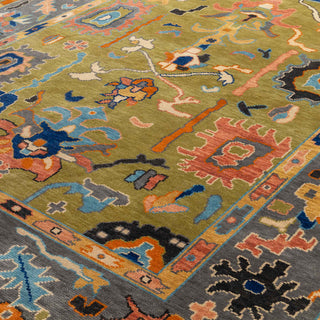 Hand-knotted wool rug featuring abstract Persian-inspired motifs in green, blue, coral and gold, 8x10 ft.