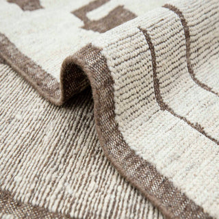  Hand-knotted wool rug featuring abstract drips in ivory taupe, 8x10 ft low pile for modern homes.