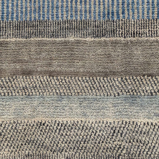 Hand-knotted wool rug featuring abstract plaid pattern in neutral beige, charcoal, blue accents, 9x12.