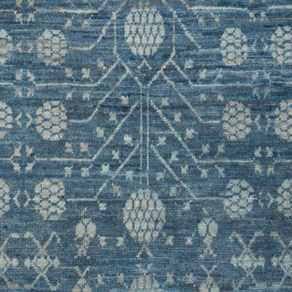 Hand-knotted wool rug featuring all-over geometric floral pattern in turquoise blue, 8x10 size