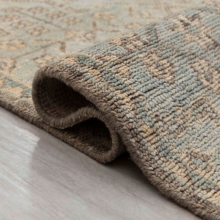 Hand-knotted wool rug featuring allover floral and leaf pattern in muted green, taupe, 9x12 size