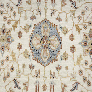 Hand-knotted wool rug featuring allover palmette and lotus floral motifs in ivory, blue, taupe, 9x12 living room size