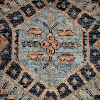 Hand-knotted wool rug featuring bold tribal medallions and border in charcoal, peach, blue, 10x14 feet