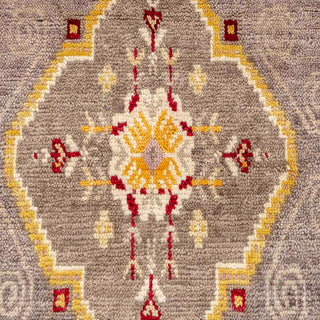 Hand-knotted wool rug featuring central diamond and oval medallions with floral motifs in brown, gold, red, 9x12.