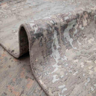 Hand-knotted wool rug featuring chunky abstract pattern in slate grey rust black, 9x12 feet.