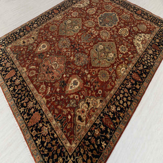 Hand-knotted wool rug featuring dense Persian floral pattern in rust, olive, beige, and navy, 8x10.
