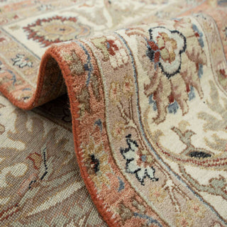 Hand-knotted wool rug featuring dense botanical and palmette pattern in rust, cream, teal, navy accents, 8x10 living-room size