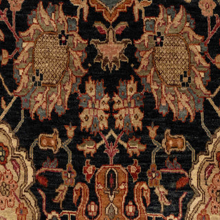 Hand-knotted wool rug featuring dense floral and medallion pattern in black field with rich red border, 8x10 ft