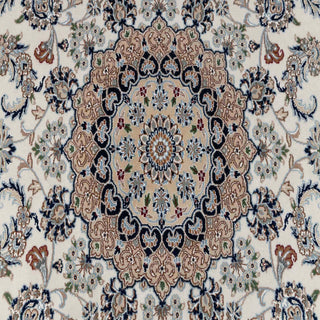 Hand-knotted wool rug featuring dense floral medallion pattern in ivory, navy, beige, 8x10.