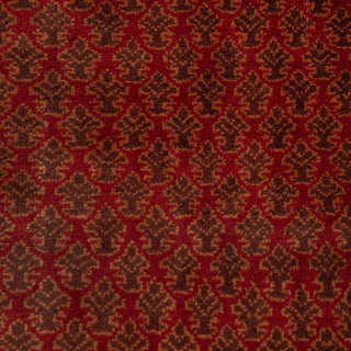 Hand-knotted wool rug featuring dense small floral pattern in red, olive, tan tones, 4x6 living room size