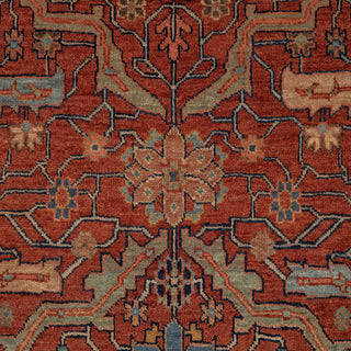 Hand-knotted wool rug featuring dense tribal geometric design on rust field with navy border, 6x9