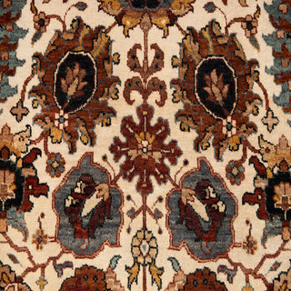 Hand-knotted wool rug featuring detailed floral pattern in ivory field with rust and blue accents, 4x6 ft