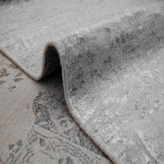 Hand-knotted wool rug featuring faded Persian pattern in light dark gray, 8x10 ft low pile